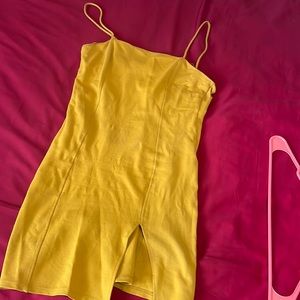 Yellow mini dress with slit. Size M. Decent stretch